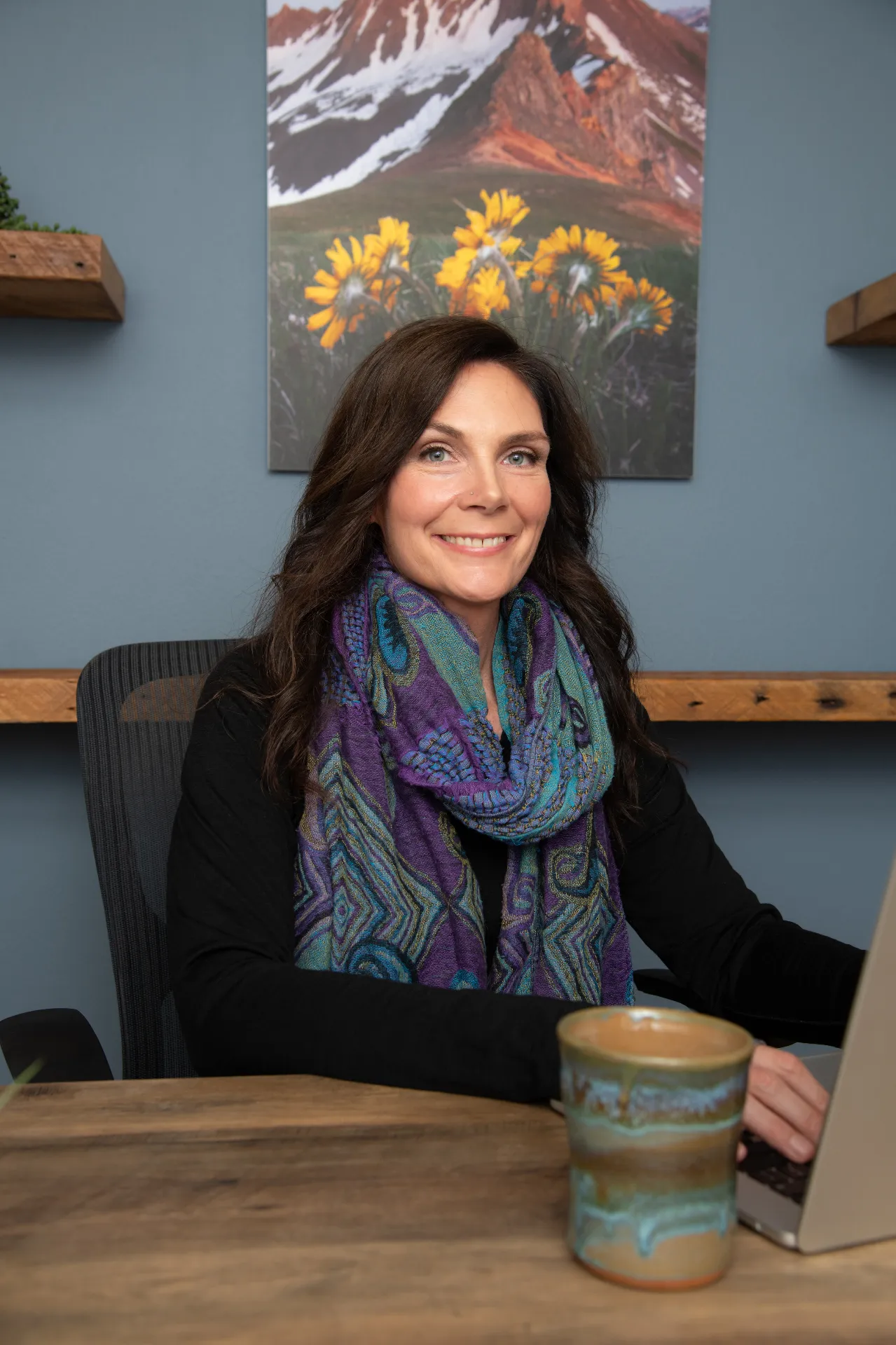 Michelle Mullins at her desk in the Arete clinic office